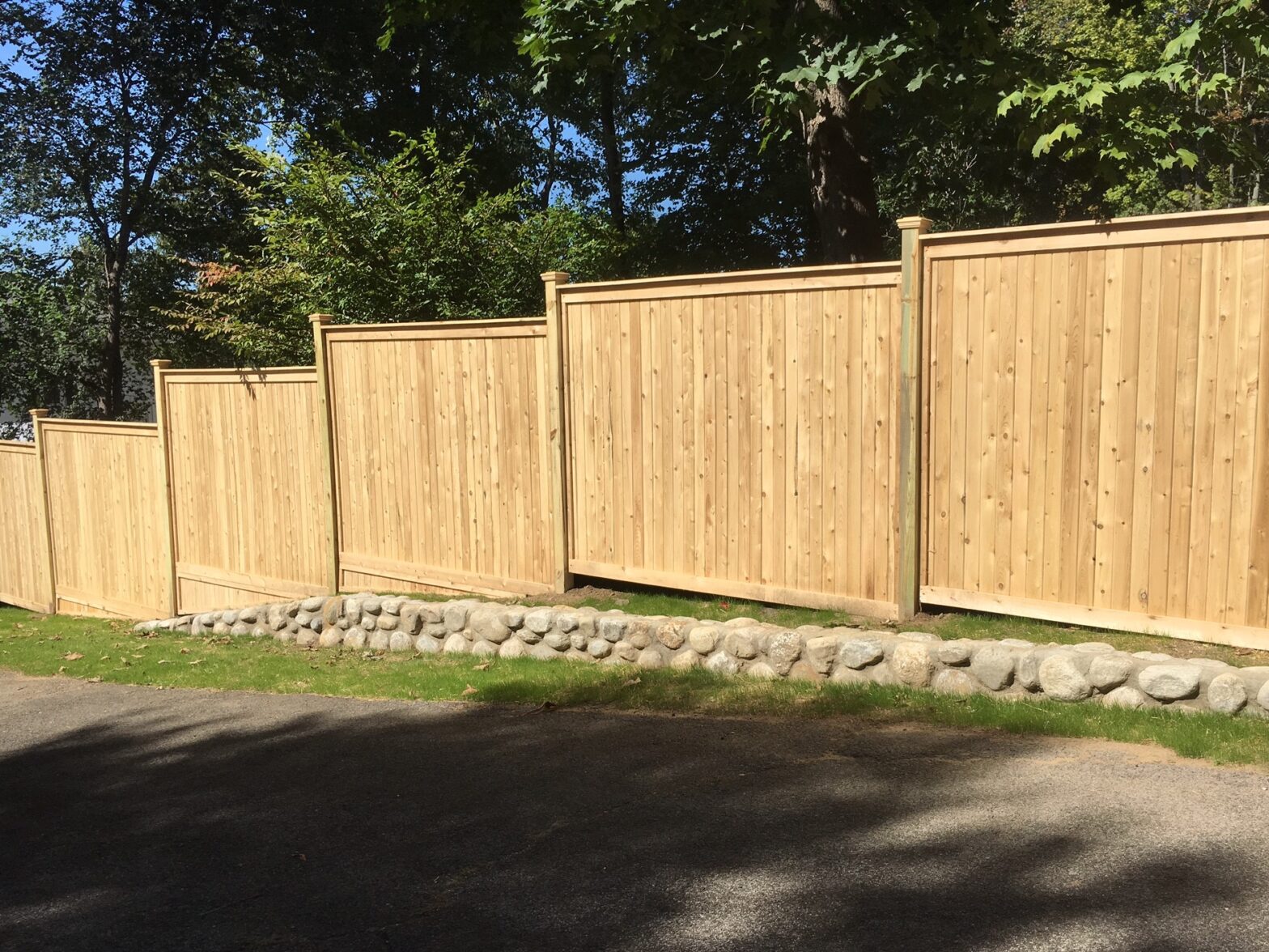 Photo of a Mahopac, NY wood fence installed on uneven ground